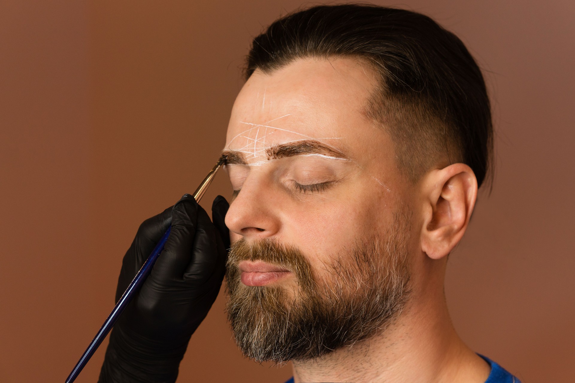 Tinting brows. Man